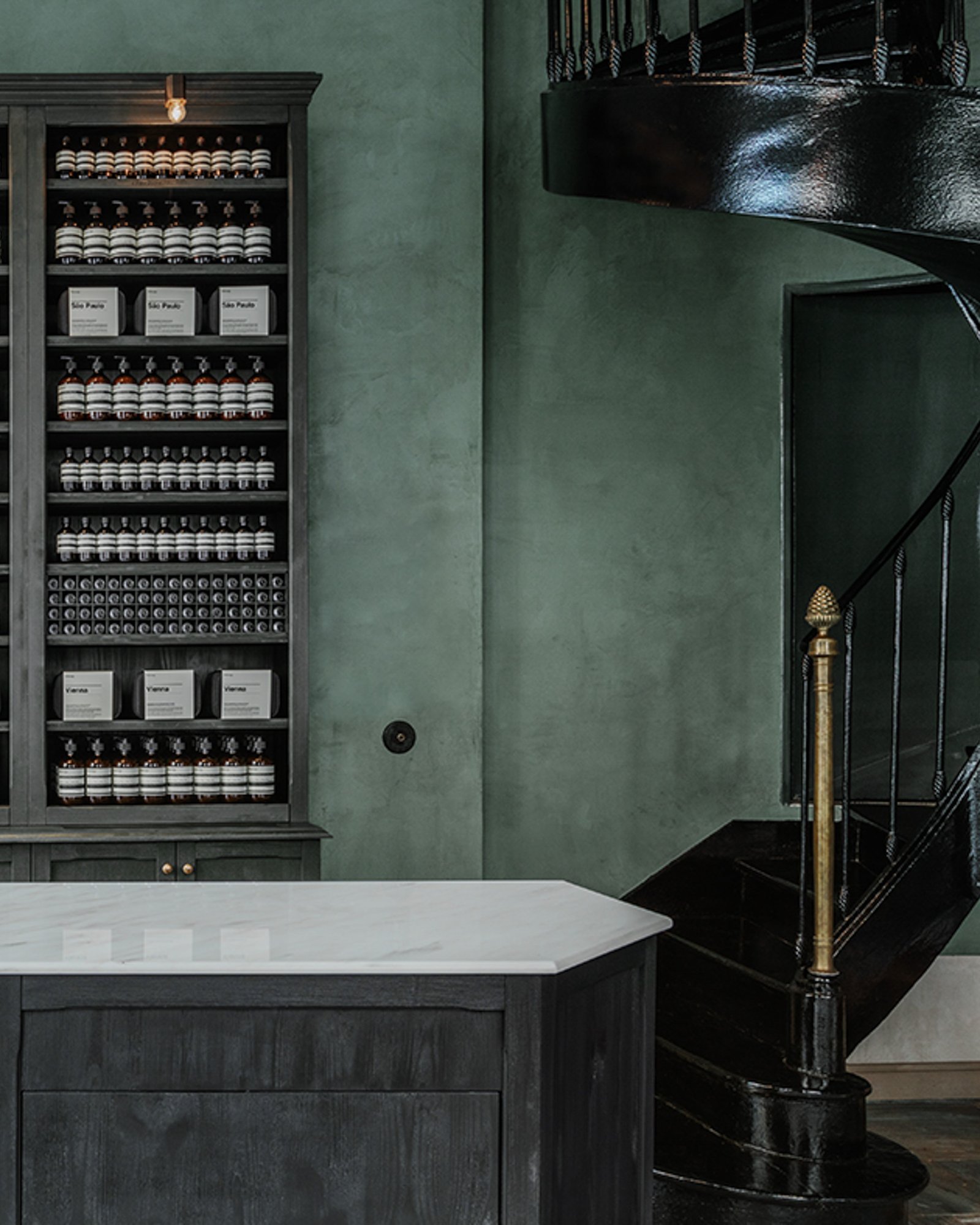 Tonal clay plaster in custom green at Aesop Bordeaux.