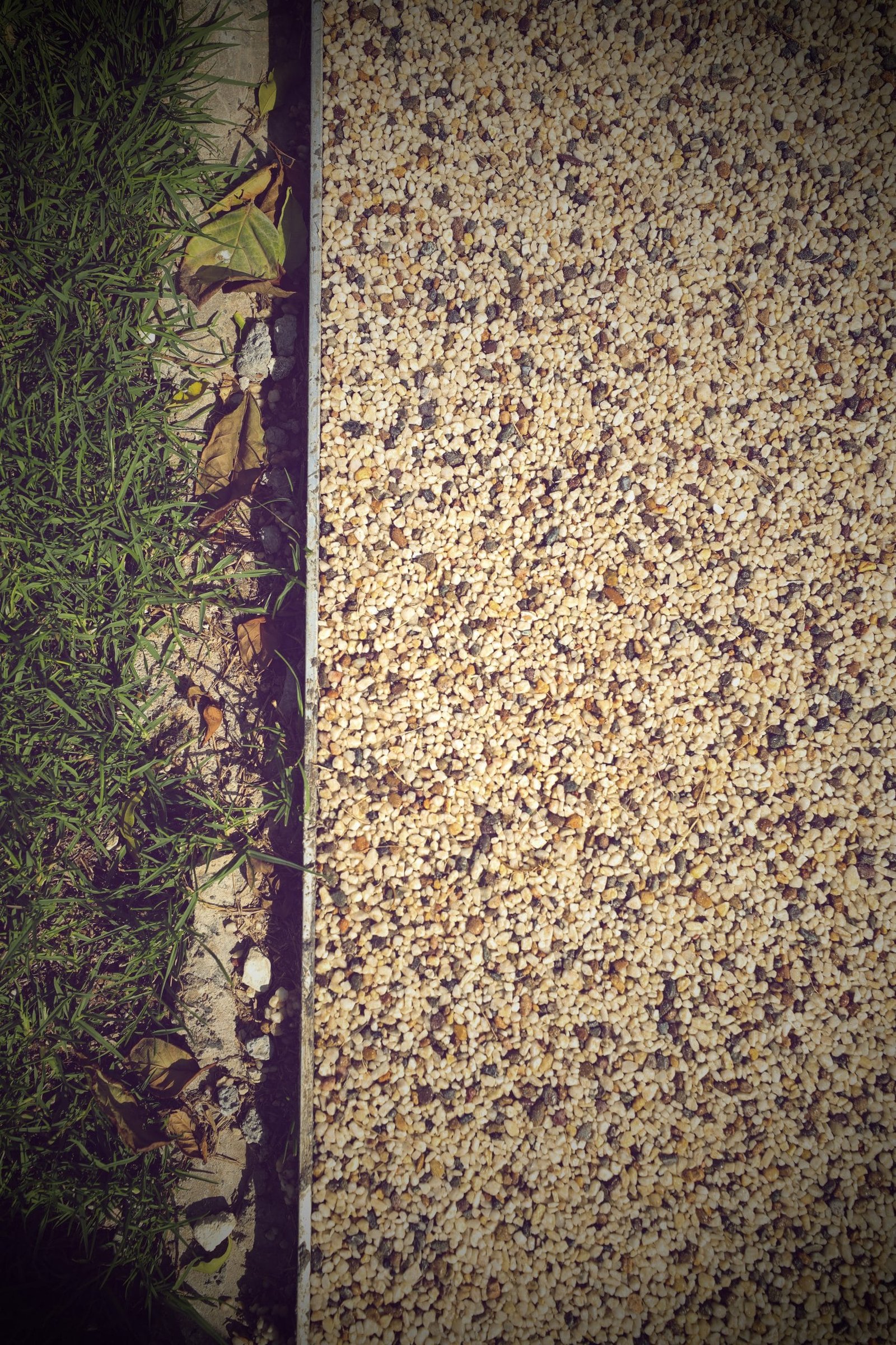Edge detail where resin bound stone carpet paving meets an upstand at Lusail Boulevard, Qatar