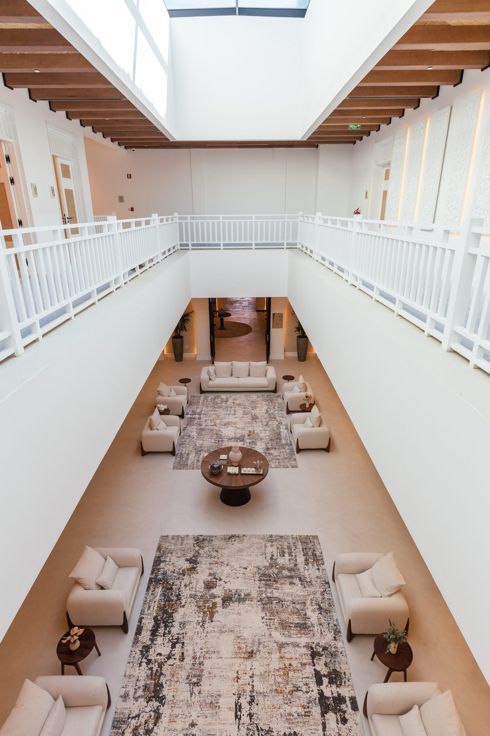 Cream Microdur Plus microcement floor in the double-height atrium lounge, Maysan Doha