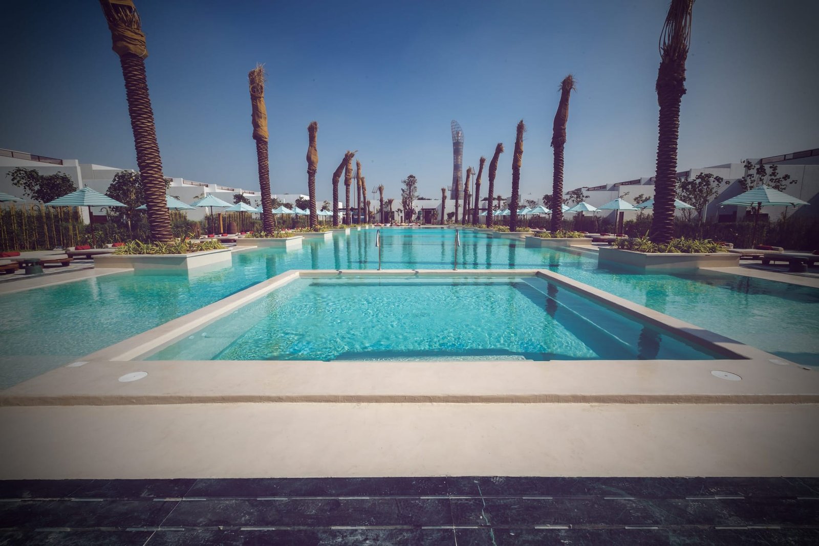 The main pool at Maysan LXR, Doha, with microcement through the pool area