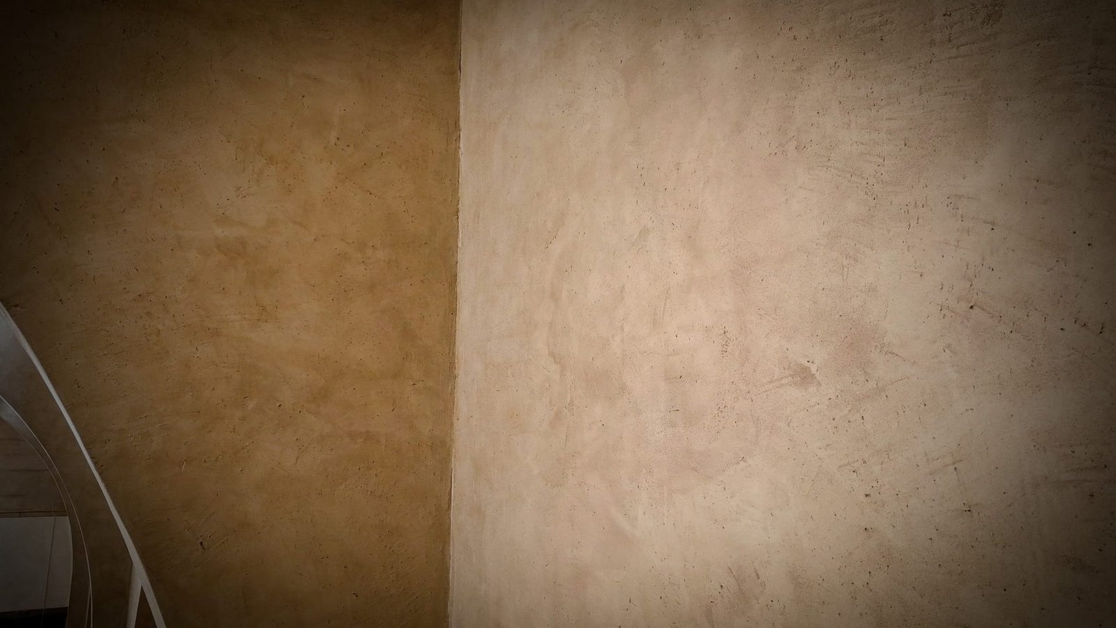 Corner detail showing hand-worked plaster texture meeting at an internal angle, Calligraphy Museum, Madinah