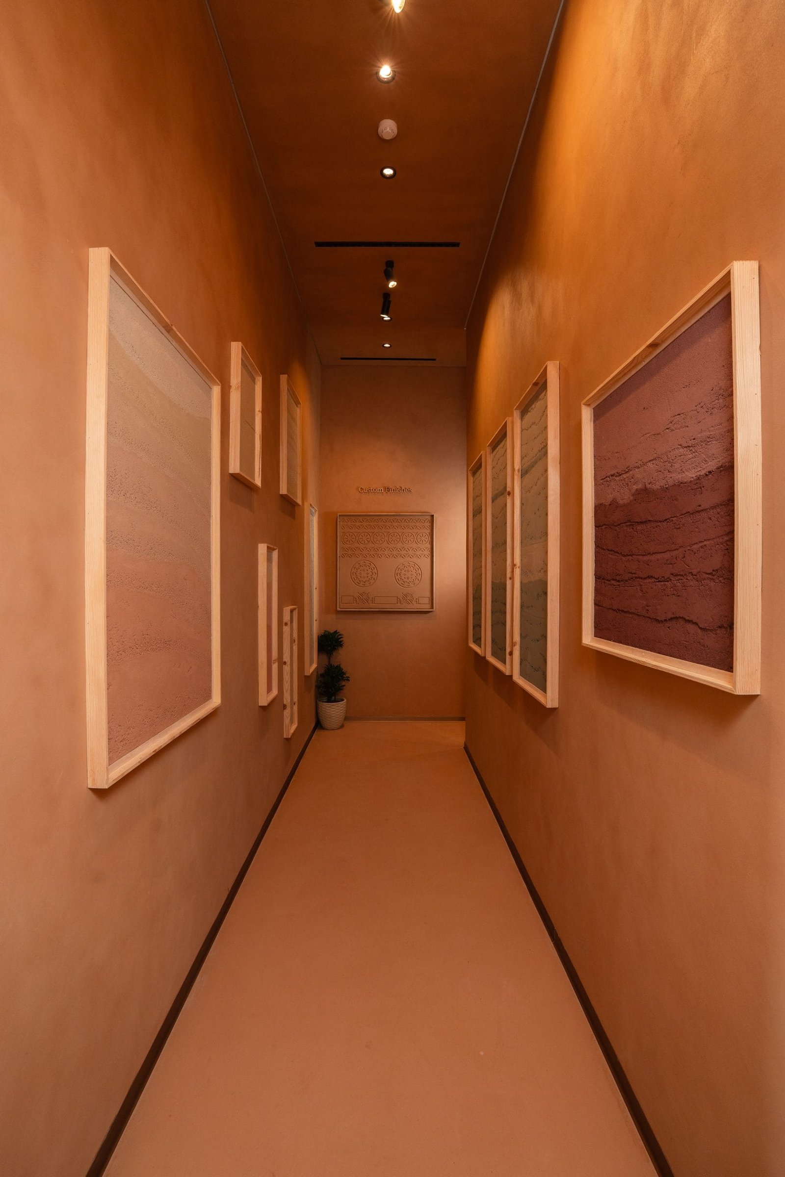 Sample corridor of framed clay plaster boards, Conmarble showroom, Riyadh