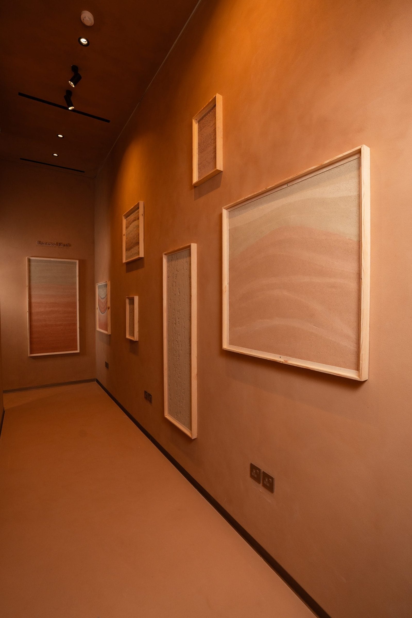 Arched sample walls of framed clay plaster boards, Conmarble showroom, Riyadh